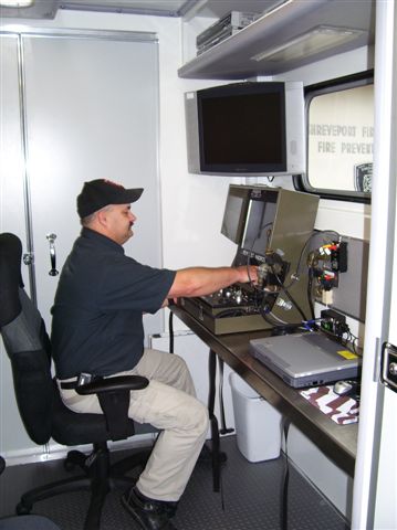 Bomb technician operating computer equipment